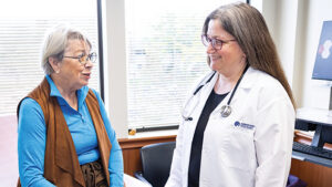 primary care physician with female patient