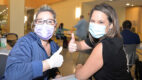Albany Med employees give a thumbs up after a Covid vaccine
