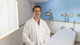 Matthew DiCaprio, MD, director of Orthopedic Oncology, standing in an empty patient room