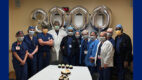 T. Paul Singh, MD's celebrates his 3000th robotic surgery with members of his surgical team, with cupcakes and mylar balloons in the shape of "3000"