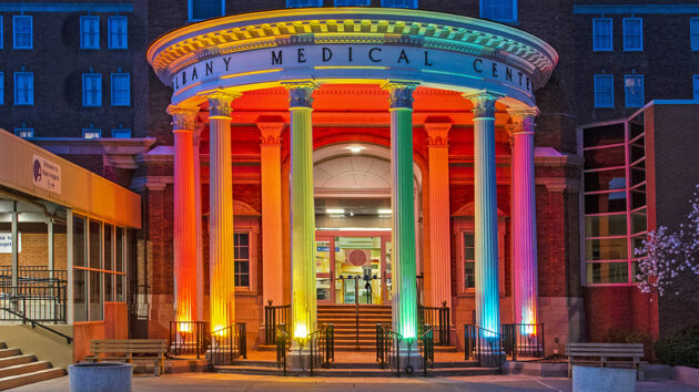 The Albany Medical Center Pillars lighted in rainbow colors