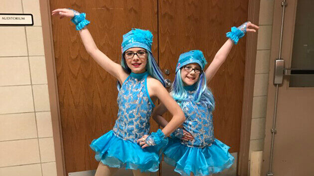 Katelyn Hogan and a classmate, dressed in dance outfits for a school production