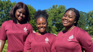 Three Albany Medical College students during the college's Day of Service working in a community garden