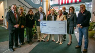 Member of Hudson River Bank & Trust present a check for $50,000 to member of the Center for Breast Health at CMH