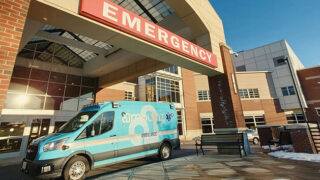 Ambulance outside of the Saratoga Hospital emergency department, emphasizing the new System Access Center