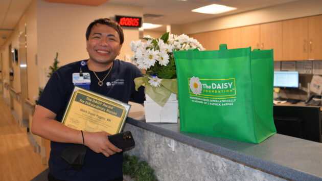 Davey Pugay, renal transplant nurse, receives the DAISY Award