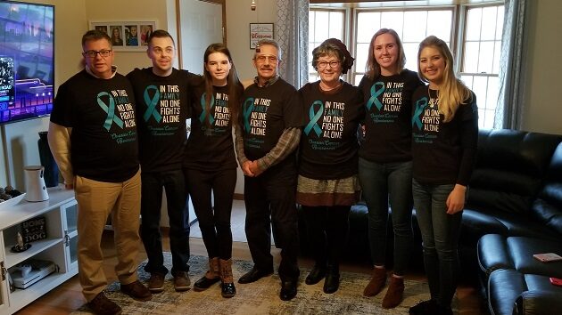 Joyce Casertino, a patient who battled Ovarian Cancer, poses with her family in matching 'Ovarian Cancer Awareness' t-shirts
