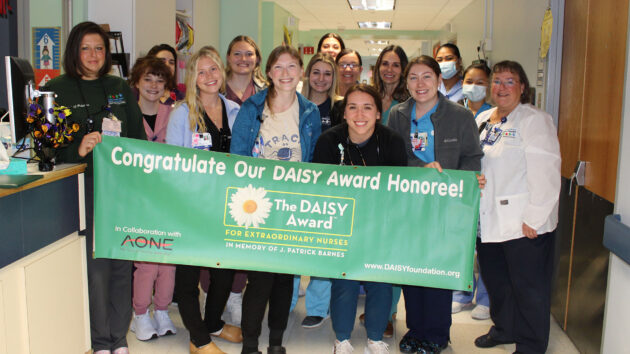 Pediatric unit holds DAISY Award banner