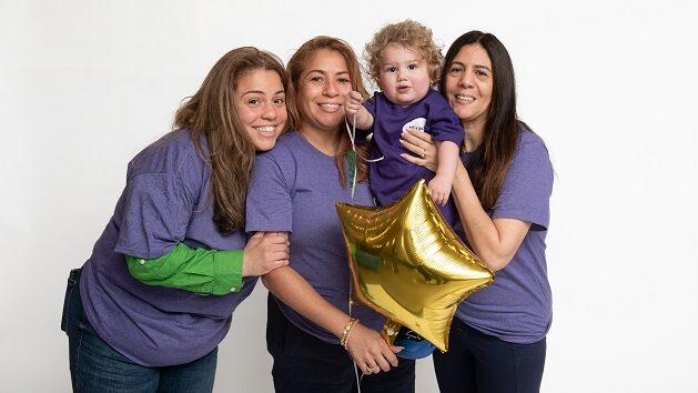 Santino Schiralli - born with a congenital heart defect. His mom Stephanie Valdez (green sleeves) works for AMC