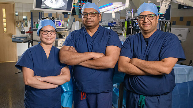 Group portrait of providers in an operating room.
