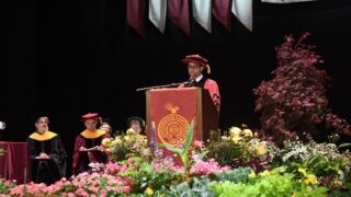 Graduate student speaker at the podium at Albany Medical College's 2024 Commencement ceremony