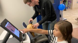 Albany Med Urgent Care clinicians demonstrate how the telehealth technology works on a stuffed animal.