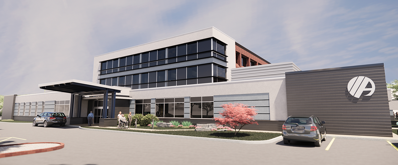 Car sitting in a parking lot outside of a health care building under a cloudy blue sky.
