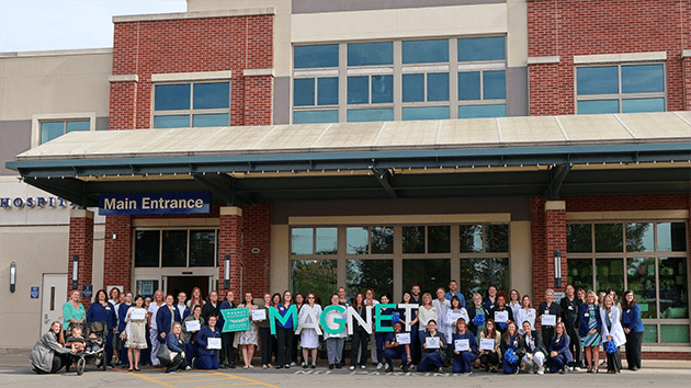 Group photo of Magnet Recognized nurses gathered in front of Saratoga Hospital