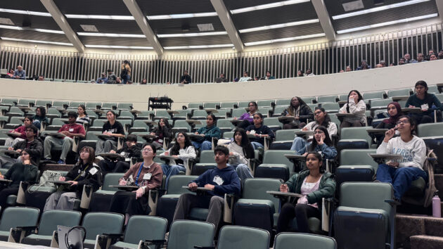 Students sitting in a lecture hall answering multiple choice questions at the 2026 Albany Regional Brain Bee