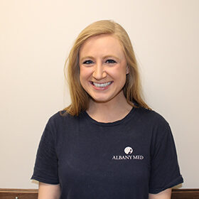 Nurse standing in front of a wall