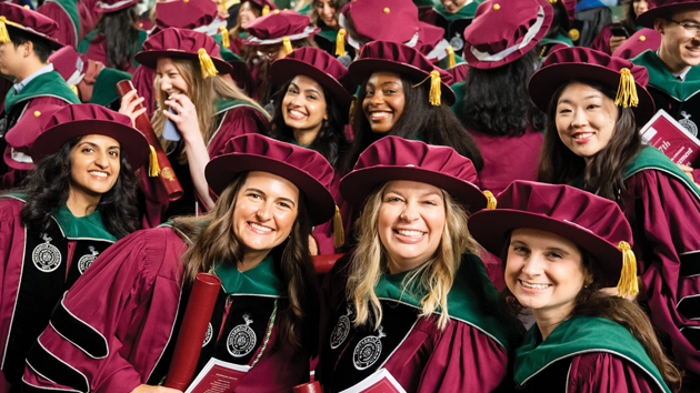 a group of medical school graduates smiling