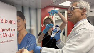 a doctor is seen using a medical device
